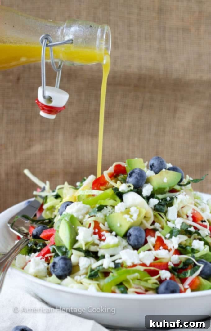 Healthy Kale and Cabbage Slaw Salad served in a large bowl, ready to be enjoyed.