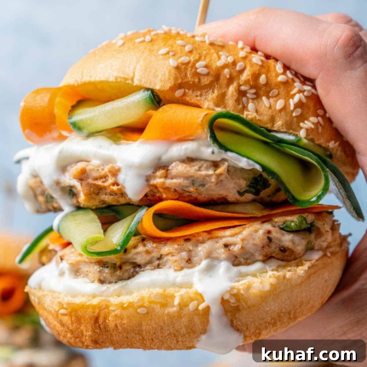 Juicy Chicken Burgers 3 chicken burger in hand.