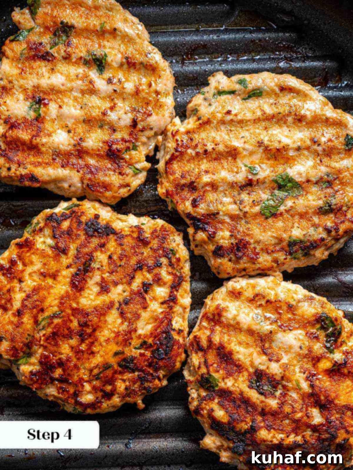 Juicy Chicken Burgers 7 grilled chicken burgers in grill pan.