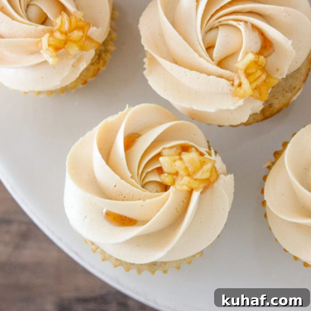 Close-up of Caramel Apple Cupcakes, showcasing the moist cake and generous frosting.