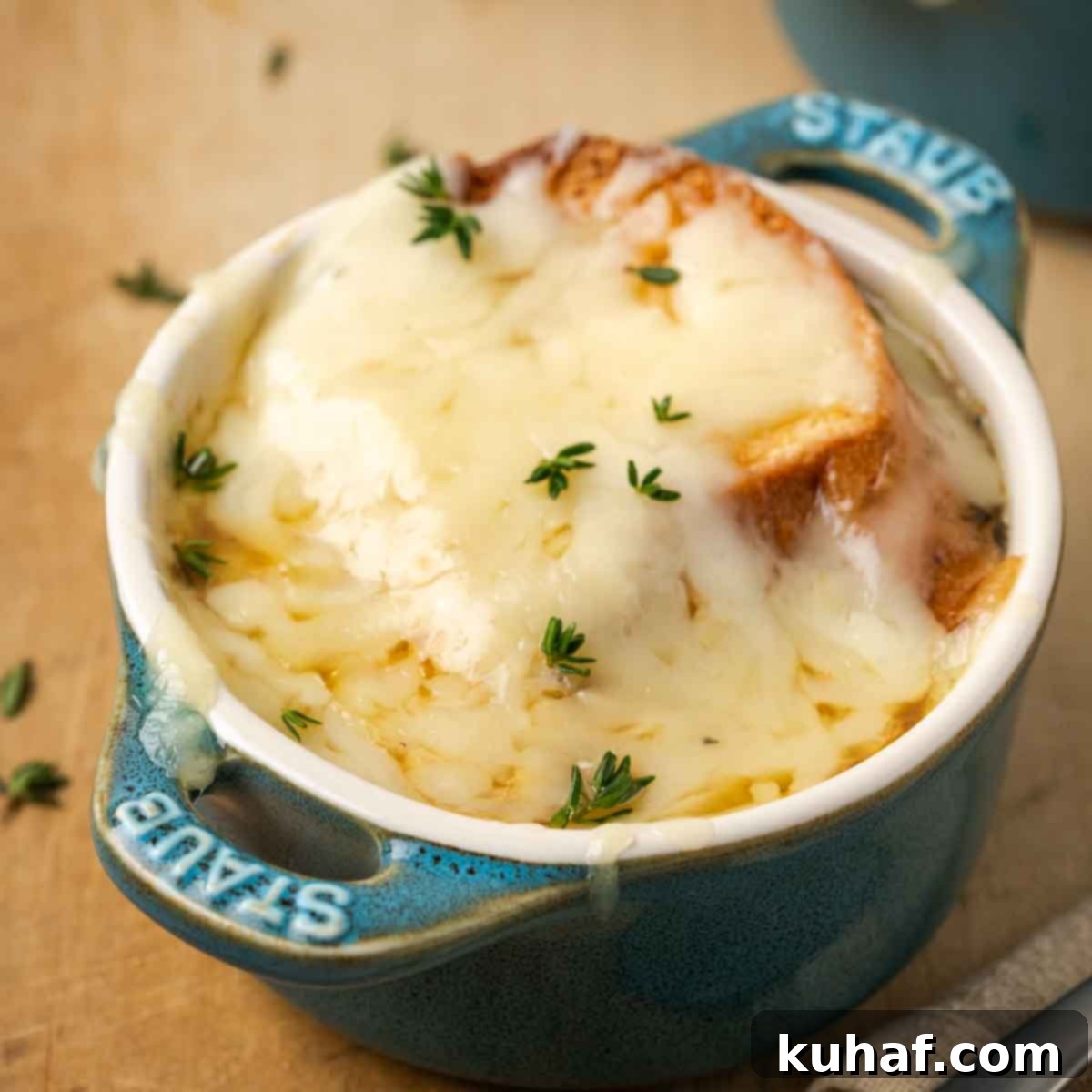 melted cheese on top of small staub baking dish.