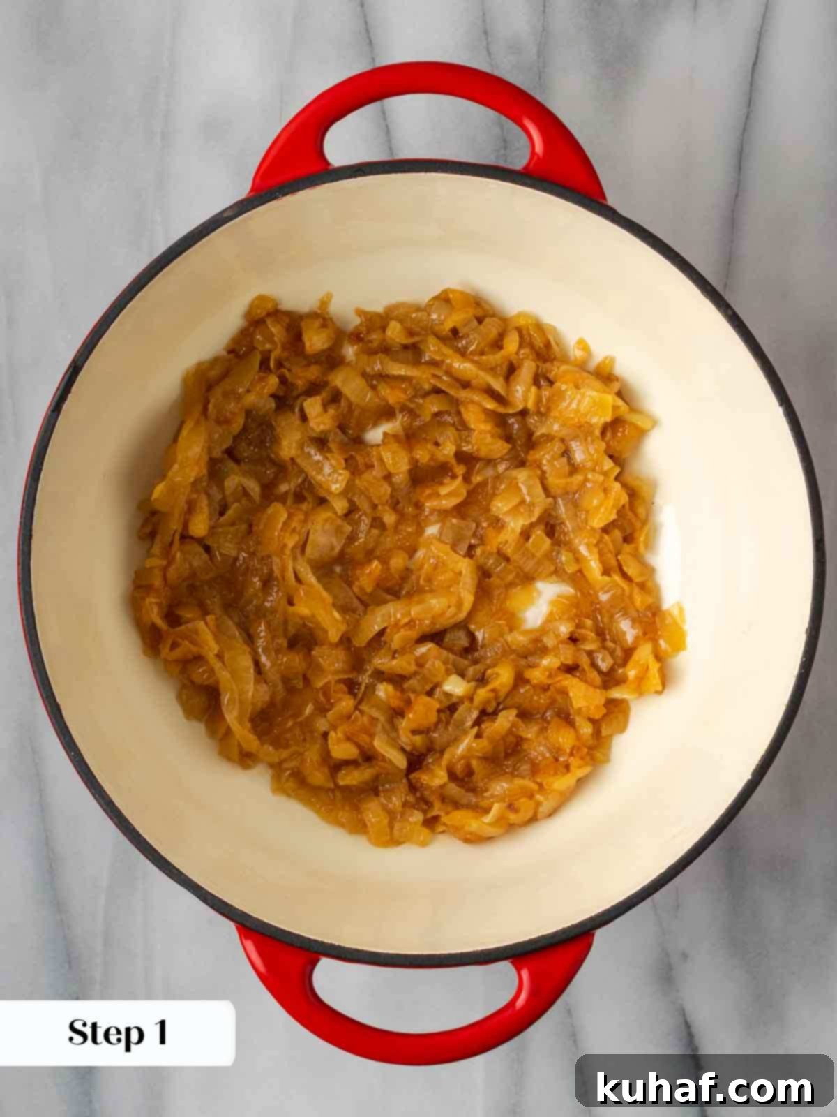 caramelized onions in red pot.