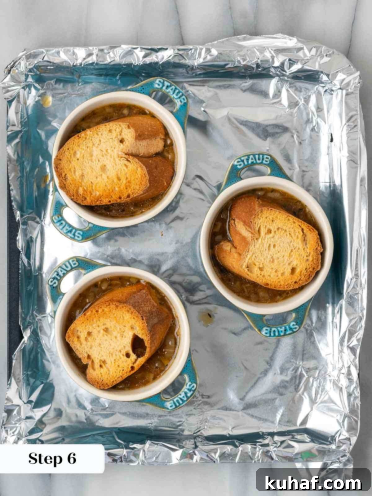 toasted bread on top of soup before cheese.