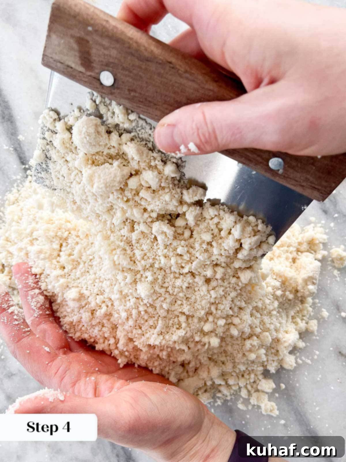 Gently tossing water into pie crust dough to combine.