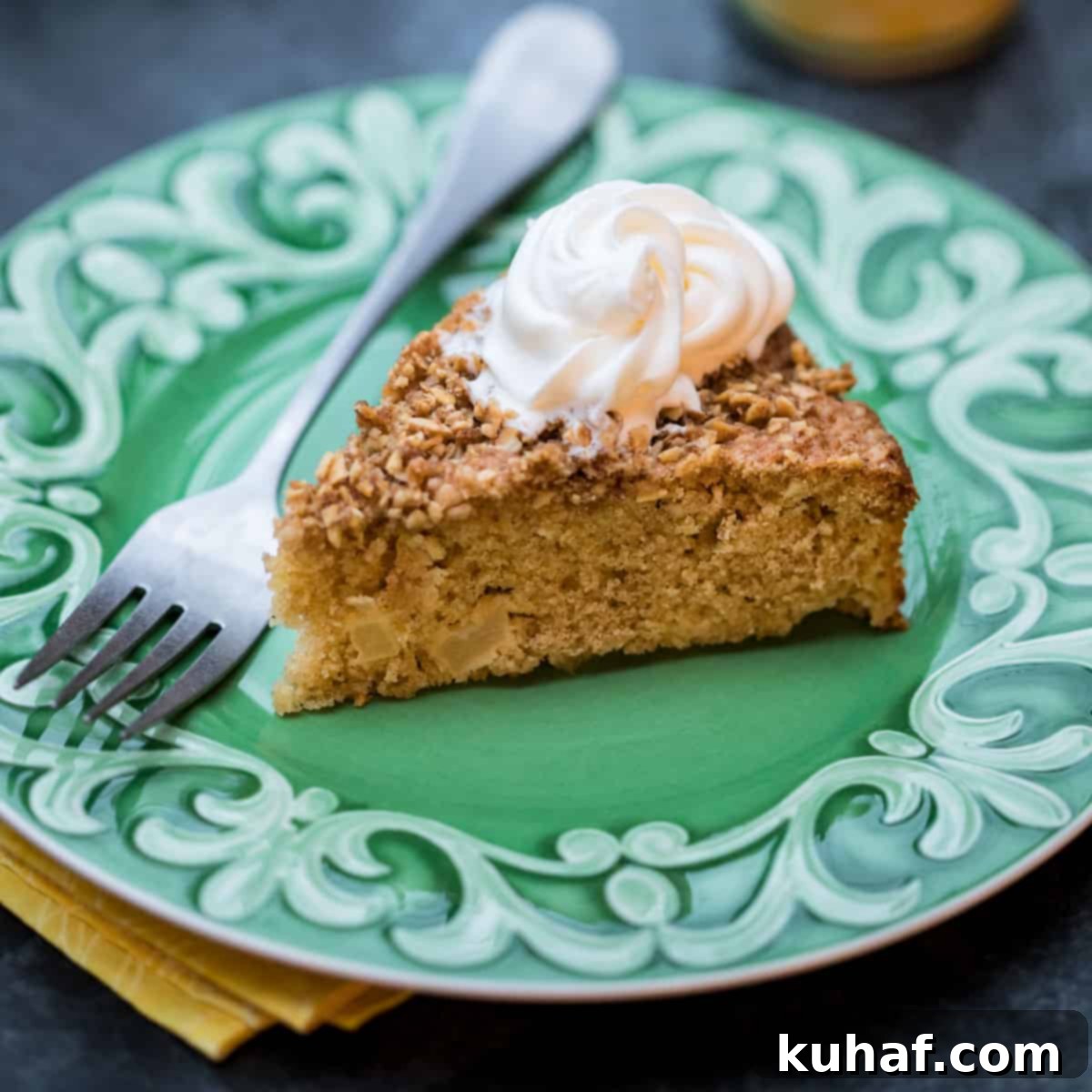A rustic Apple Almond Cake, showing its moist interior and crumble topping.