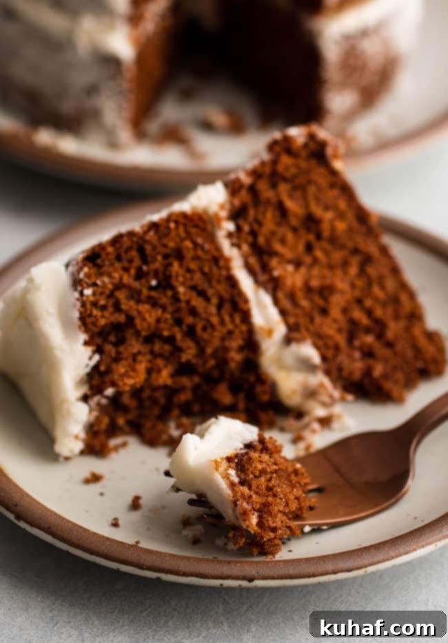 A richly spiced apple butter cake slice, showcasing its moist texture.