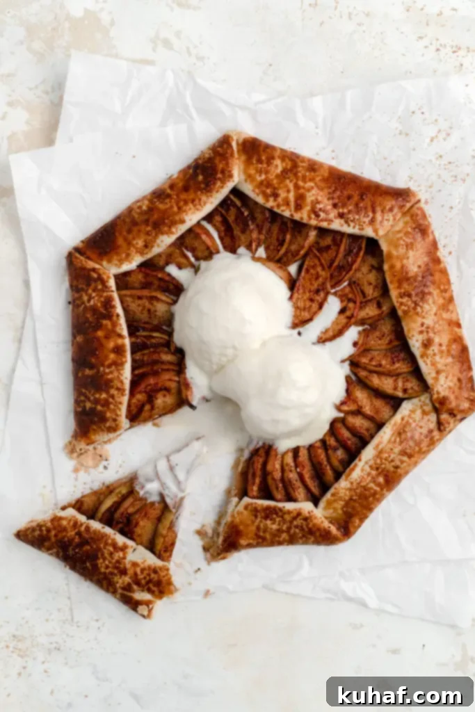 A beautifully rustic apple galette, with a perfectly golden crust, ready to serve.