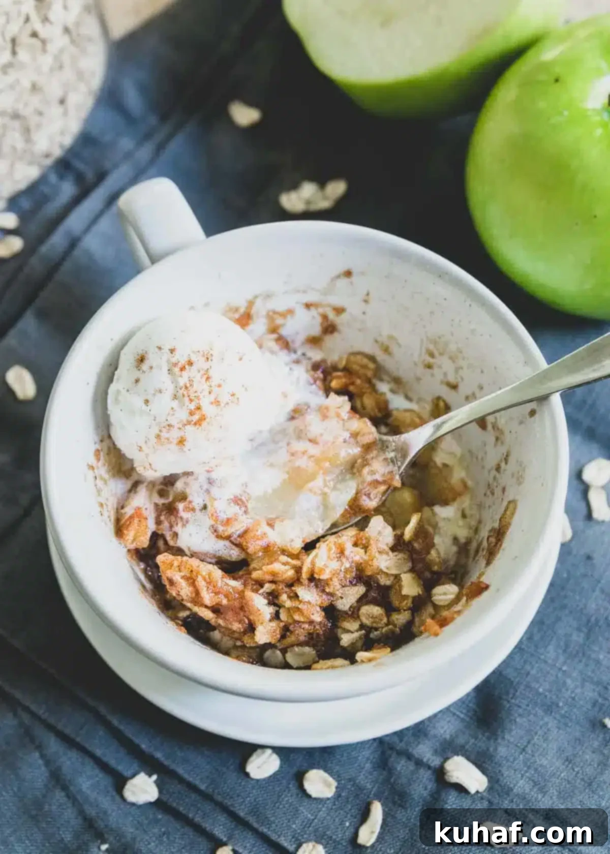 A single serving of microwave apple crisp, warm and inviting, ready to eat.