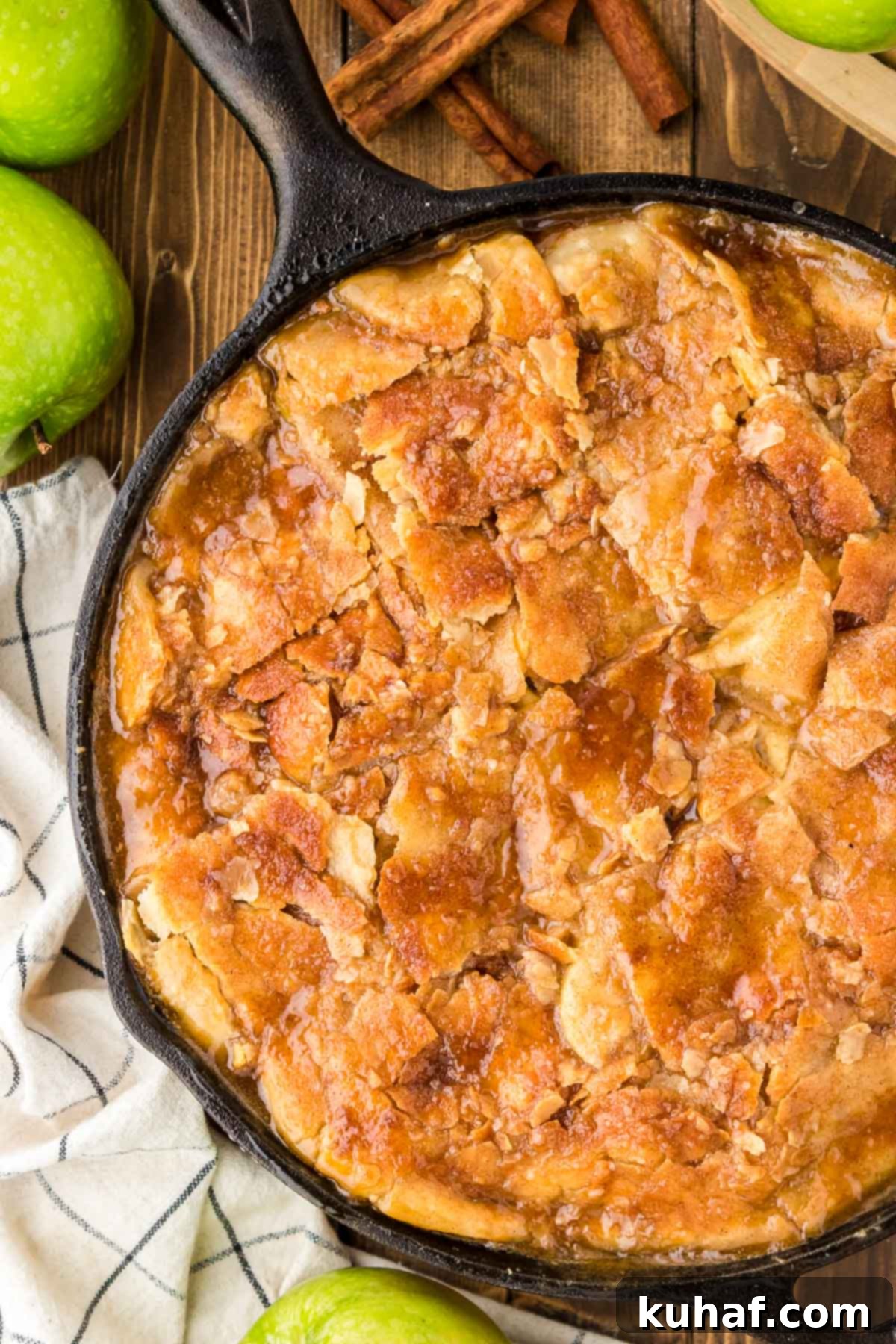 Rustic baked apple pandowdy in a skillet, with a delicious golden crust.