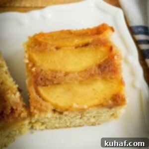 Apple Upside Down Cake slice with caramel apples on top.