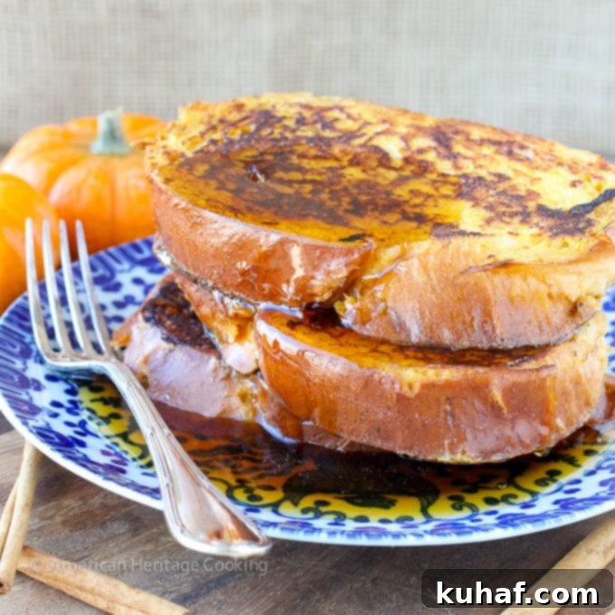 Stack of Pumpkin Spice French Toast topped with butter and maple syrup