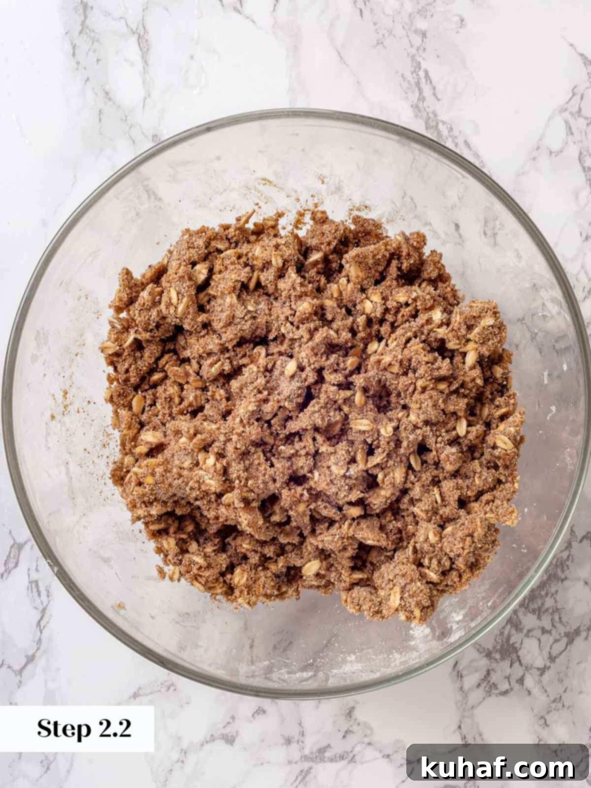 Mixed apple crisp topping, showing crumbly texture with butter incorporated.