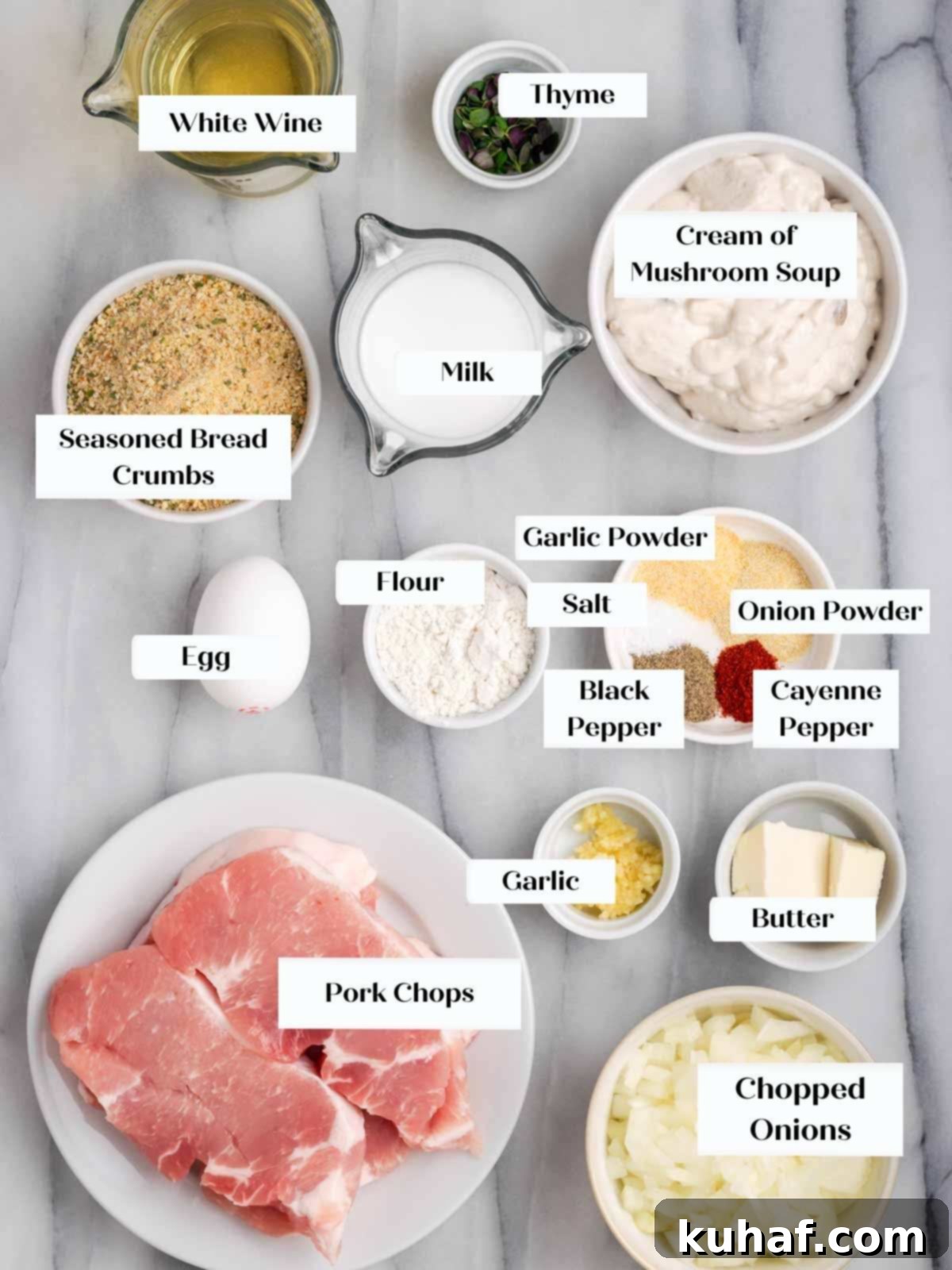 ingredients for pork chops on marble.