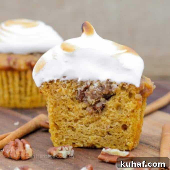 A tray of freshly baked Sweet Potato Casserole Cupcakes, ready for frosting. Notice the pecan topping.