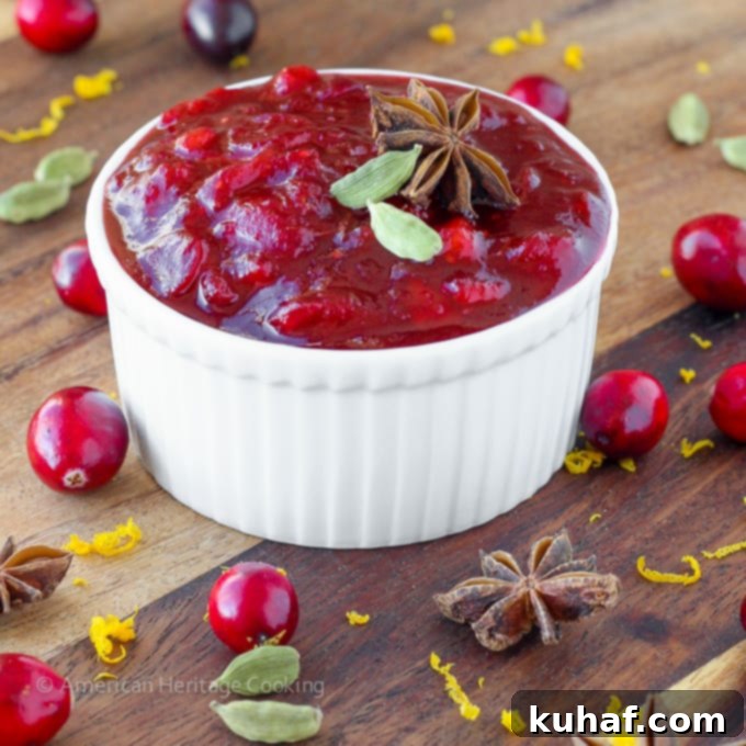 Vibrant Spiced Apple Cider Cranberry Sauce simmering with whole spices, perfect for holidays and everyday meals.