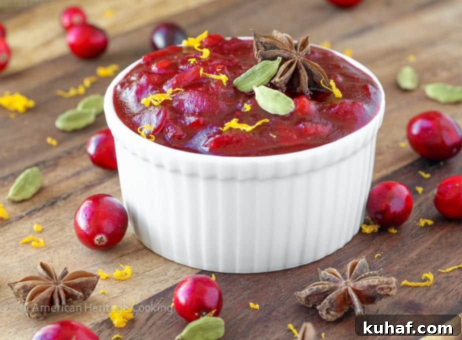 Close-up of the rich, ruby-red Spiced Apple Cider Cranberry Sauce texture, showcasing its homemade appeal.