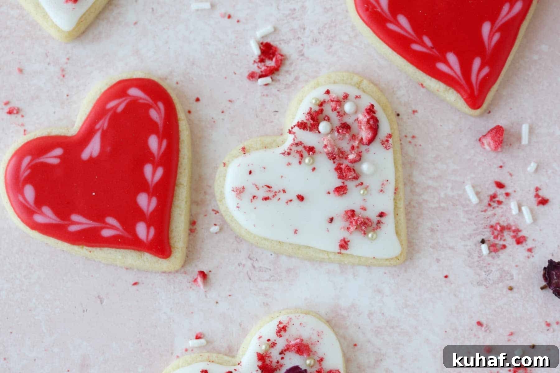 A charming display of red and white decorated sugar cookies, artfully arranged to showcase their various designs and festive appeal.