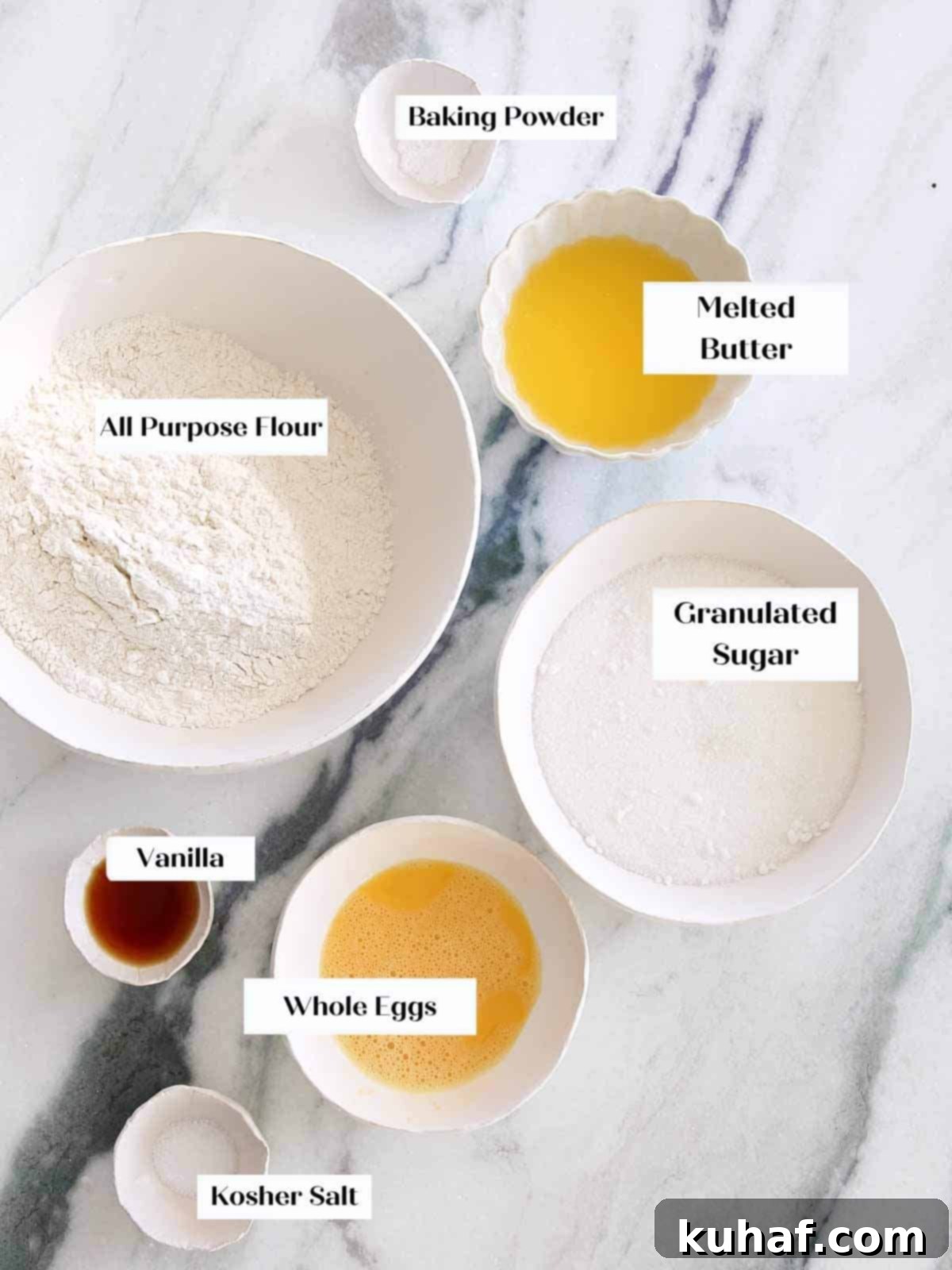 A curated selection of fresh ingredients laid out, ready for baking delicious Valentine's Day cookies, including flour, butter, sugar, and eggs.