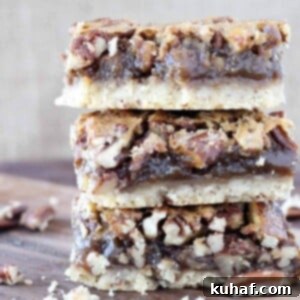 Stacked pecan pie bars on a wooden surface with a warm brown background, highlighting their delicious layers and inviting texture.