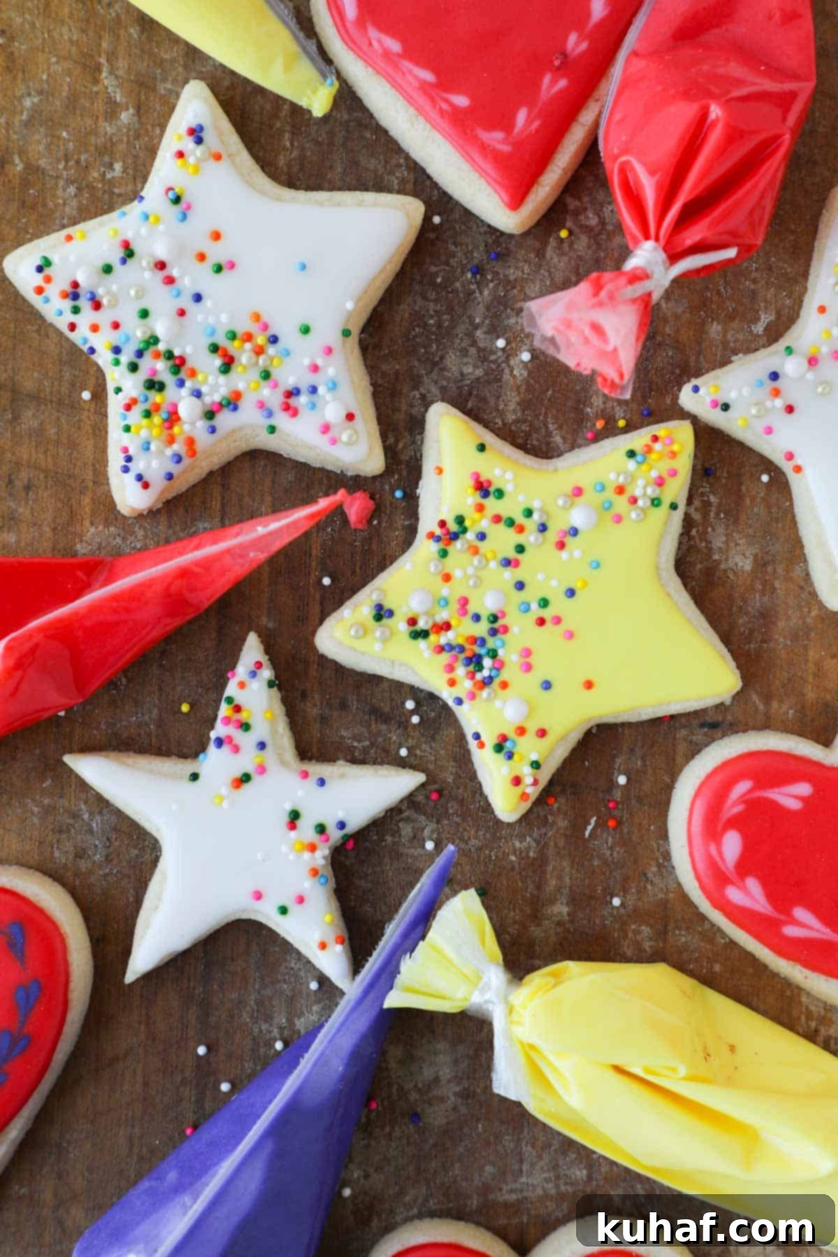 iced stars in yellow and white on wooden surface.