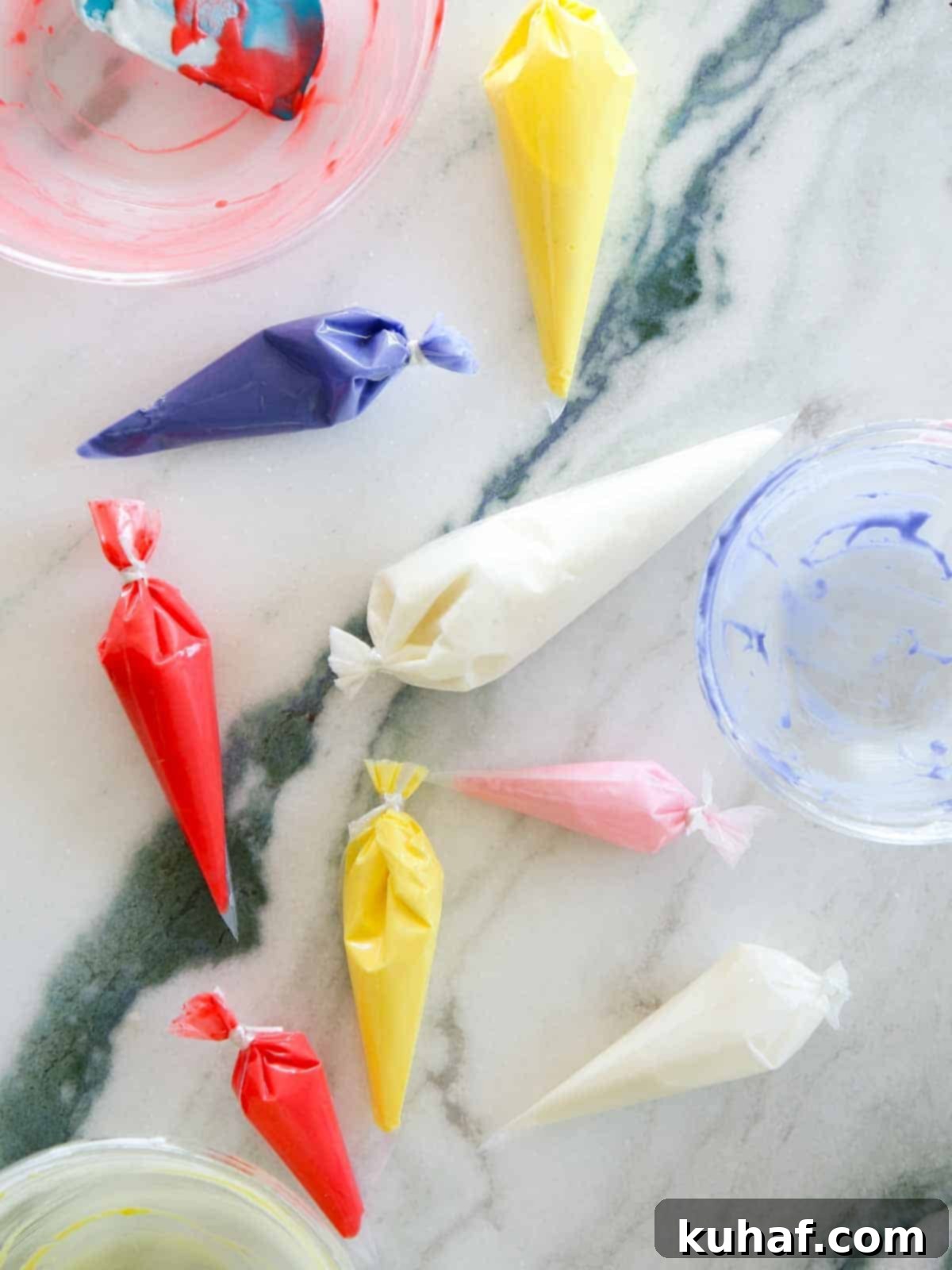 royal icing in bags on marble.