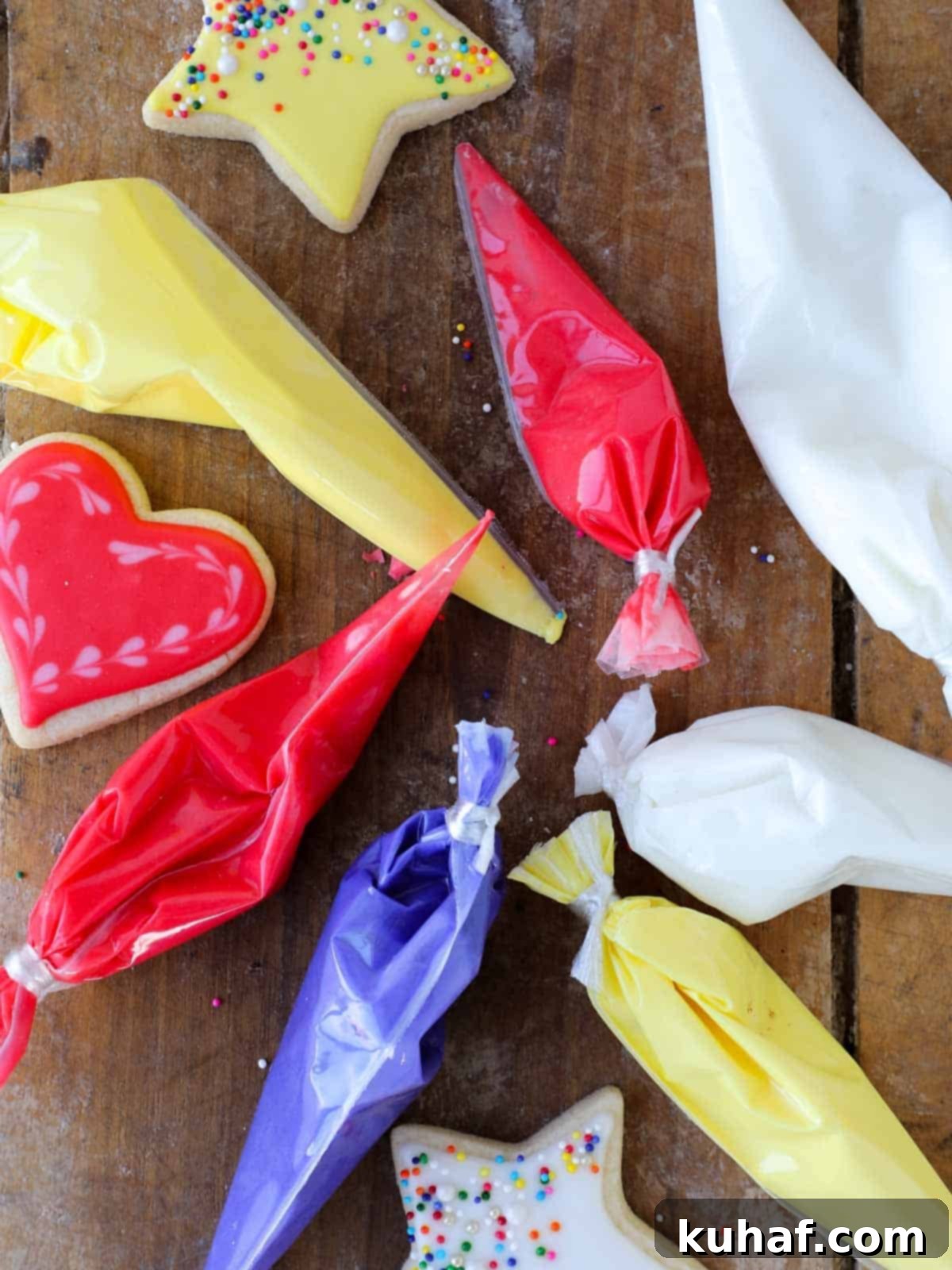 red purple yellow and white bags of royal icing.