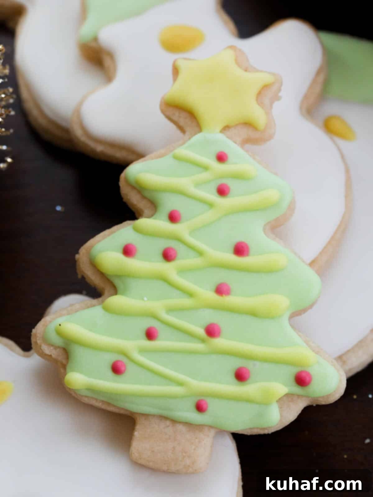 Christmas tree decorated sugar cookie.