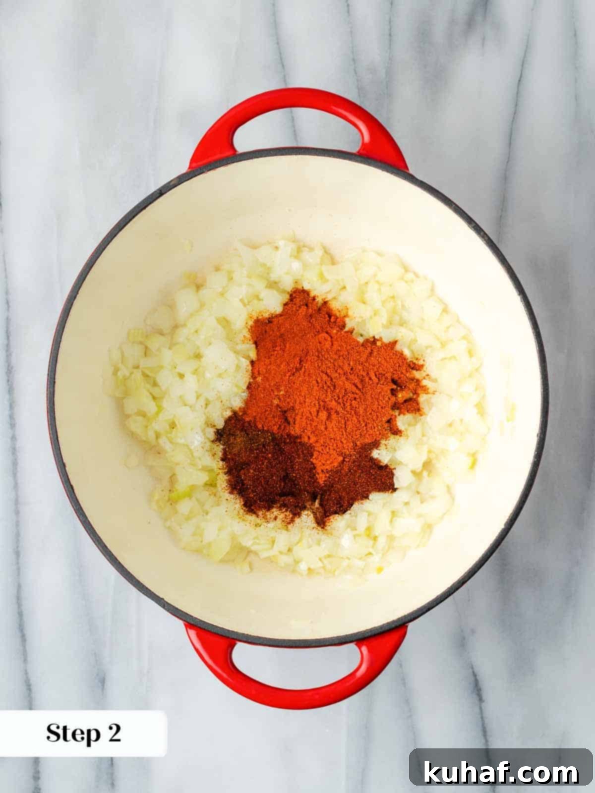 Cooking spices with onions in oil, creating a fragrant base.
