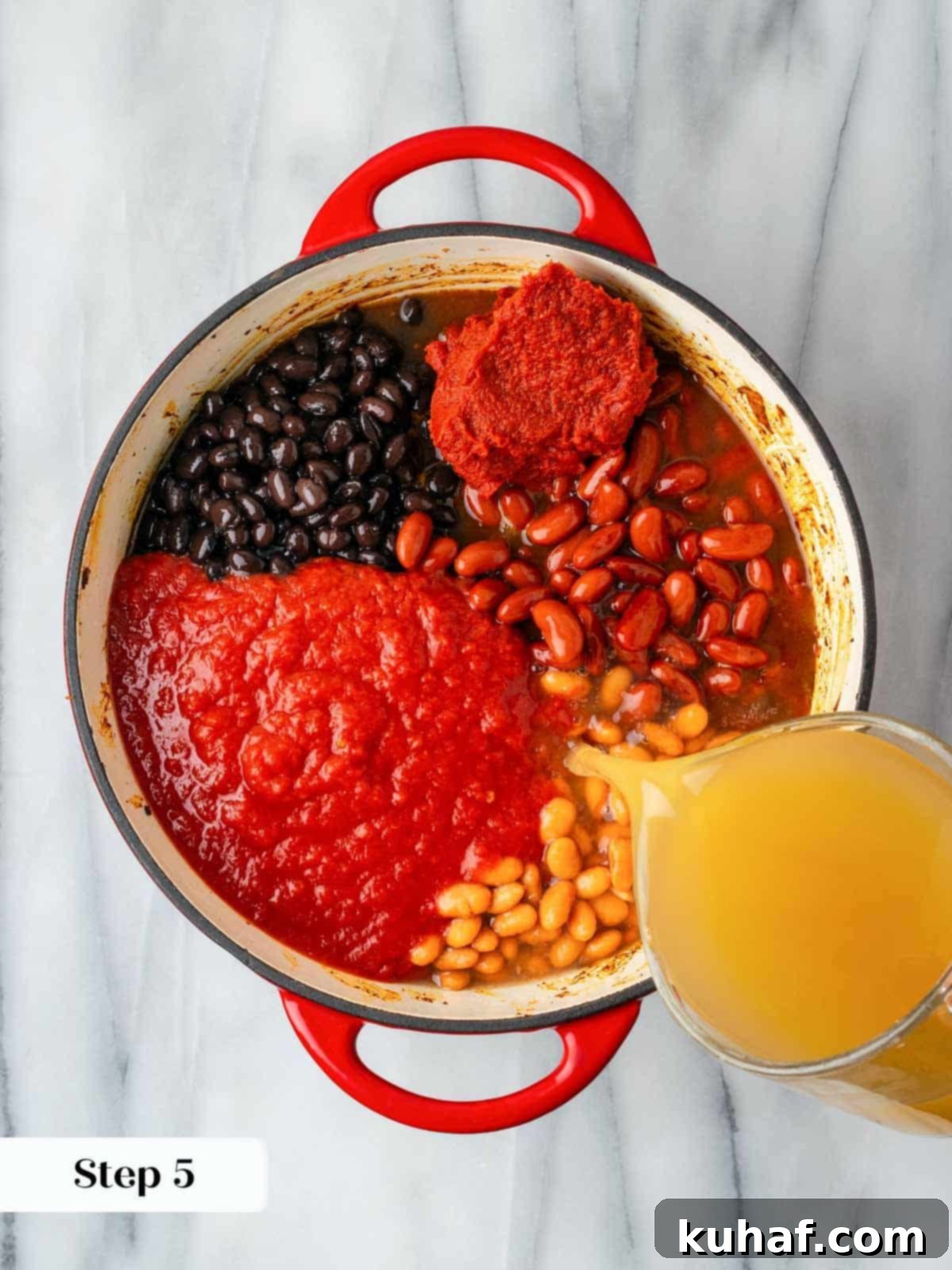 All ingredients for turkey chili added to a Dutch oven before simmering.