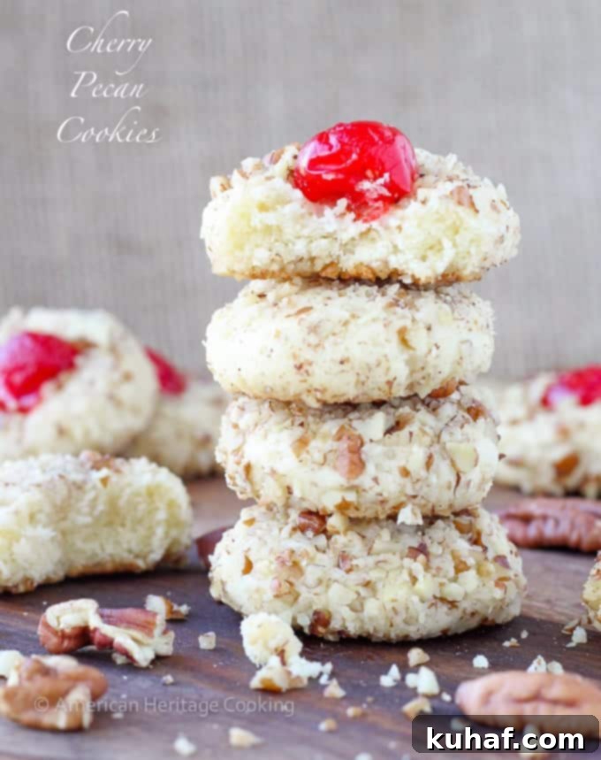 These easy Cherry Pecan Cookies are soft, chewy and nutty. A cream cheese sugar cookie is generously flavored with almond extract and rolled in pecans! My favorite Christmas Cookie recipe of all time! 