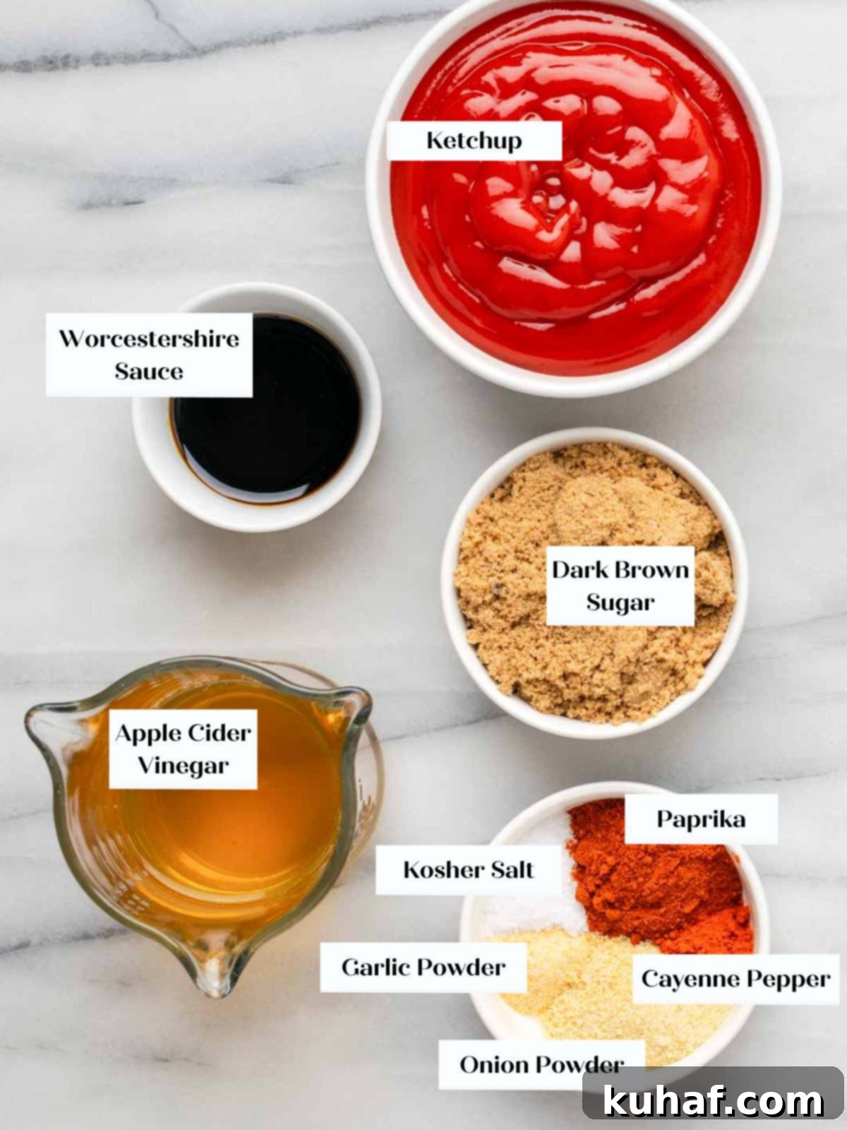 All the essential ingredients for homemade BBQ sauce – ketchup, vinegar, sugar, molasses, and spices – neatly arranged on a rustic wooden table.
