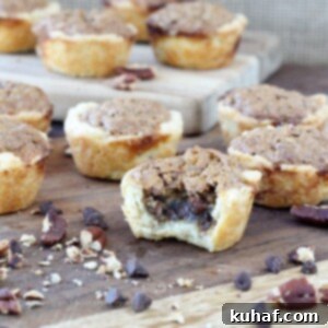 These Chocolate Pecan Tassies are like mini pecan pies with a cream cheese crust! Based on my great-grandmother's recipe!
