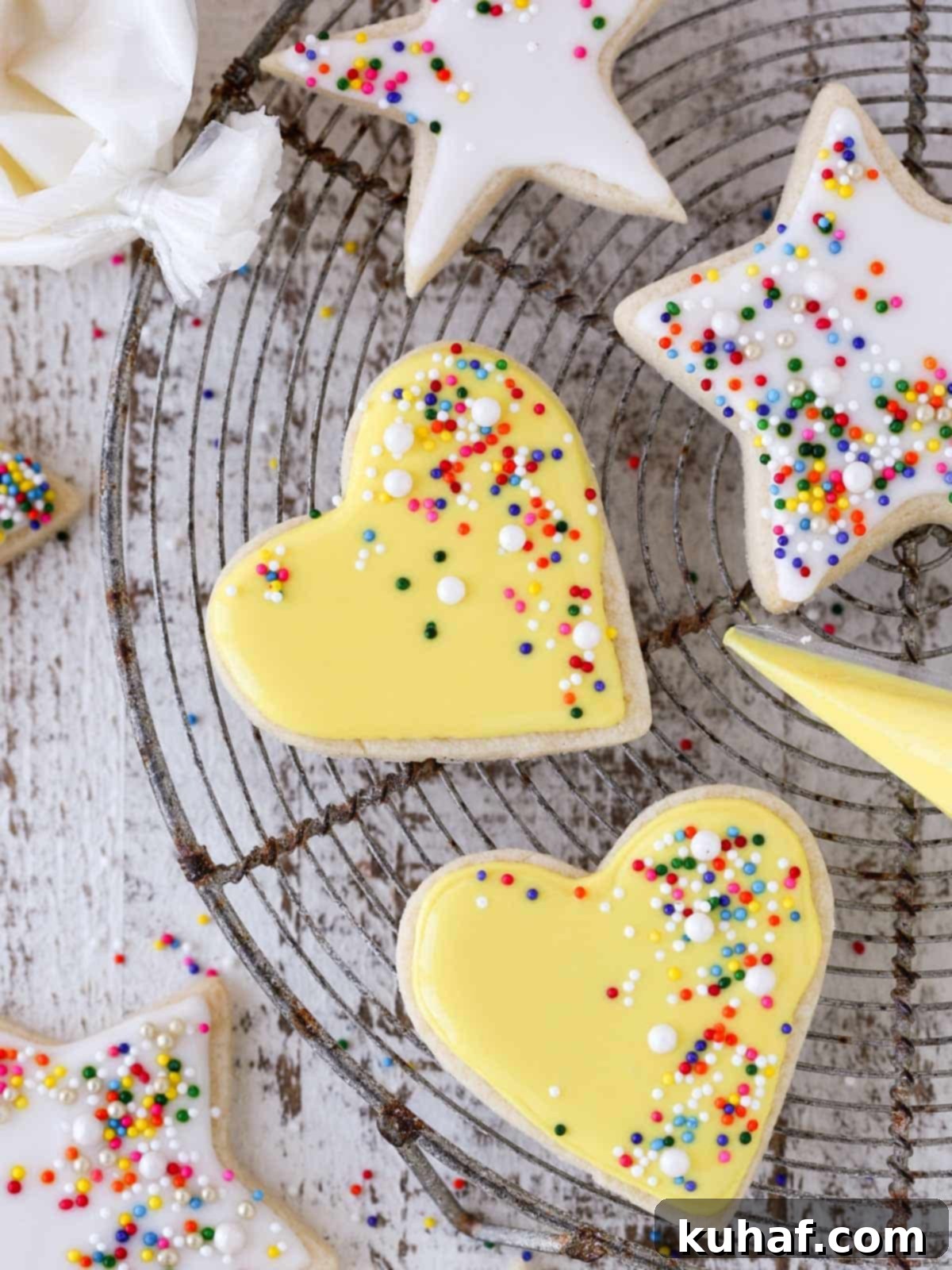 sugar cookies decorated with royal icing white and yellow. 