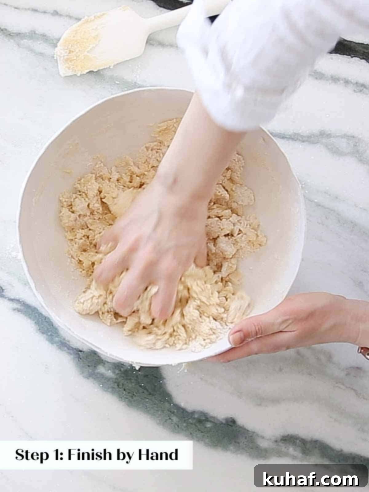 mixing sugar cookie dough by hand.
