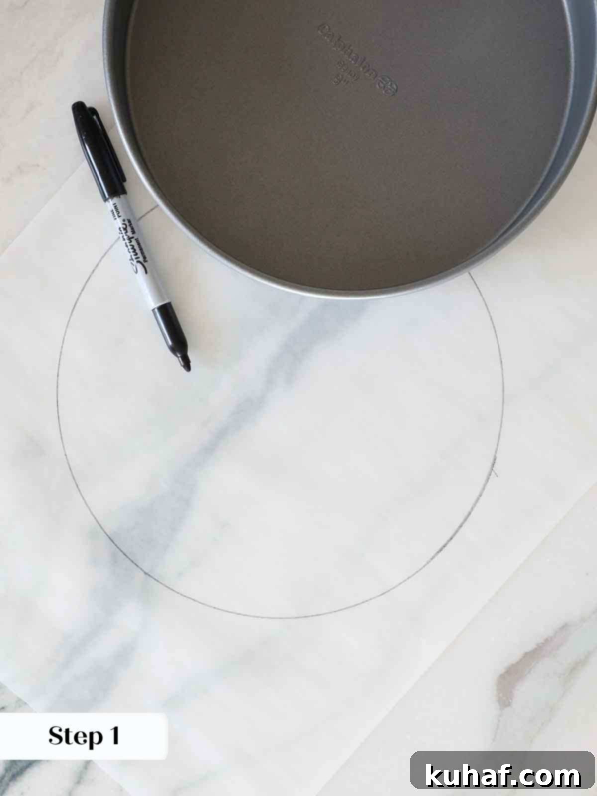 drawing circle on parchment for lining cake pans.