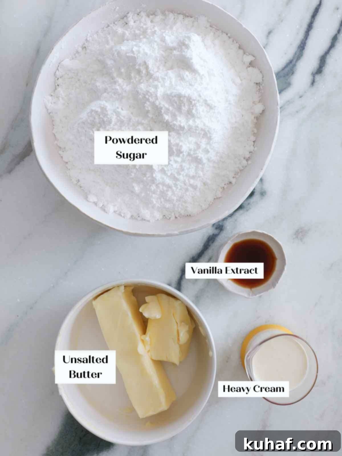 Ingredients for American buttercream frosting laid out on a marble countertop.