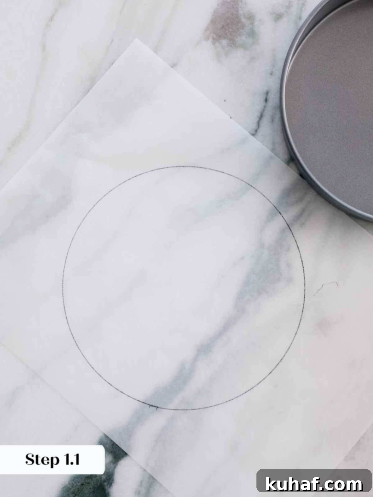 Tracing a circle on parchment paper using a cake pan as a guide.