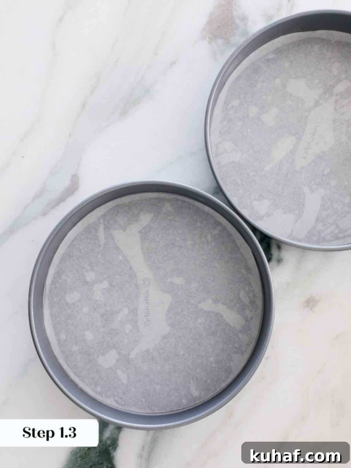 Prepared cake pans, greased and lined with parchment paper.