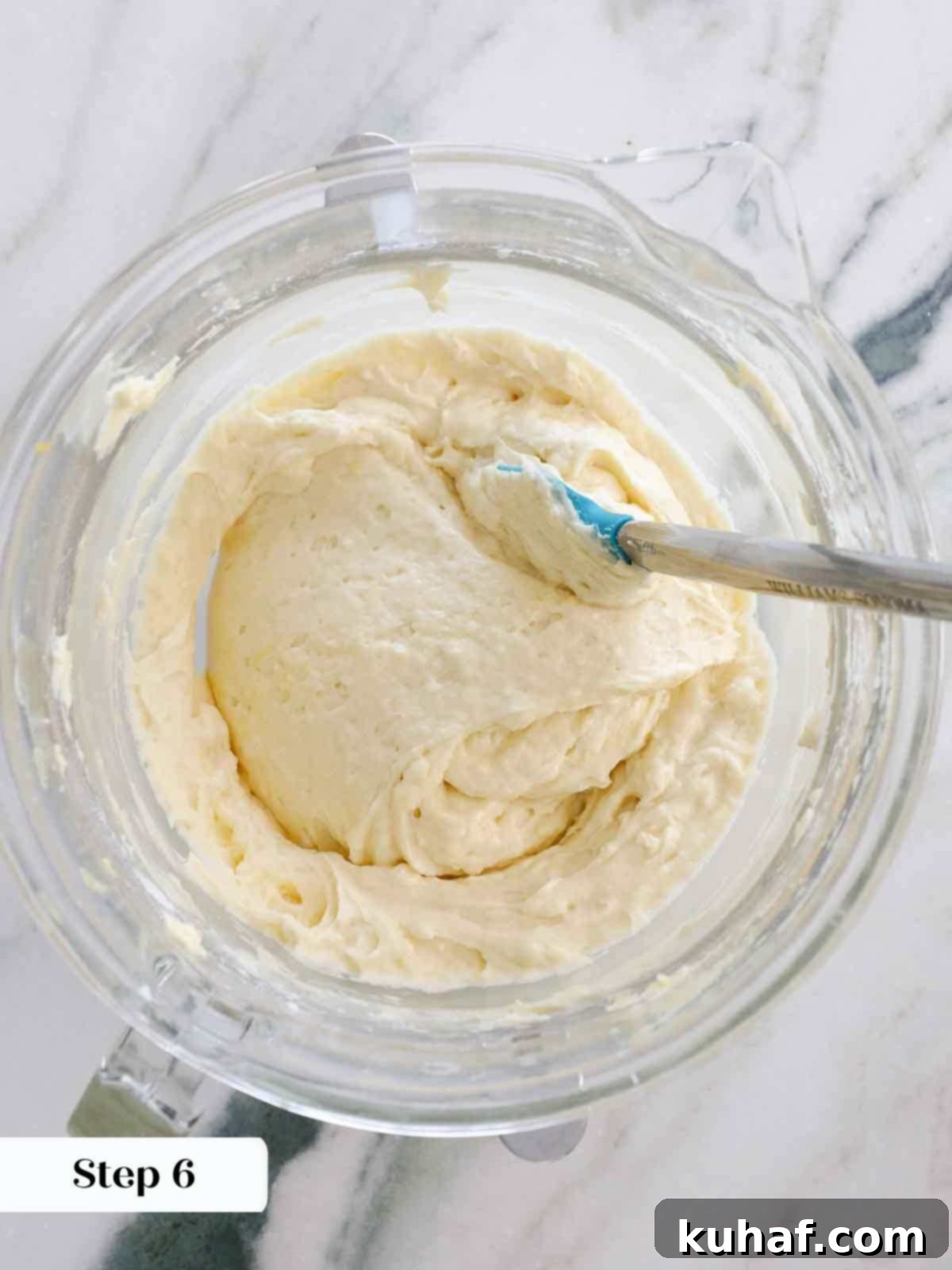 finished lemon cupcake batter in clear mixing bowl.