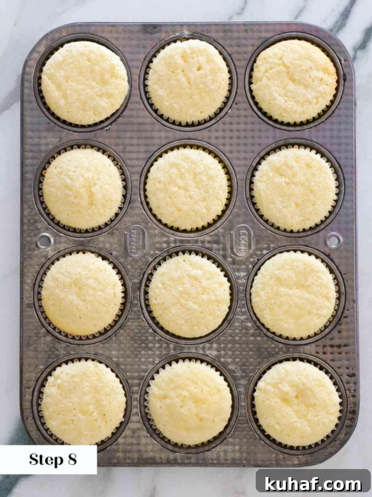 baked lemon cupcakes in tin.