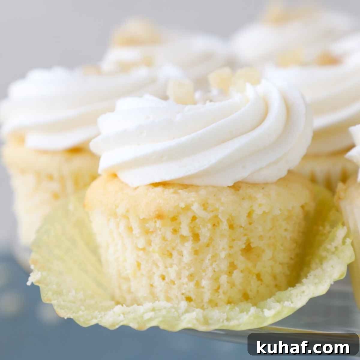 unwrapped lemon cupcakes with yellow liner.