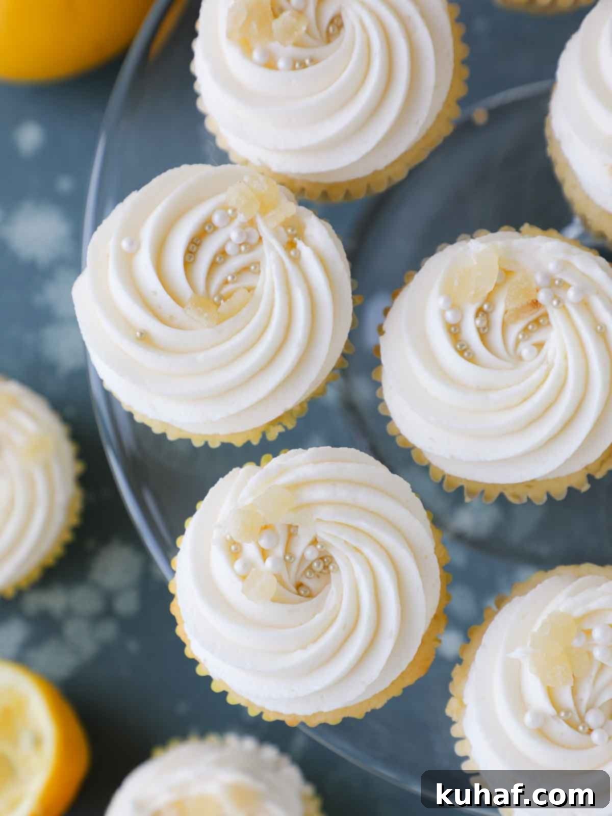 frosted lemon cupcakes on glass vintage cake stand.