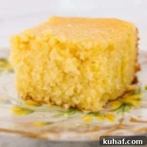 sweet cornbread slice on vintage plate with yellow flowers.
