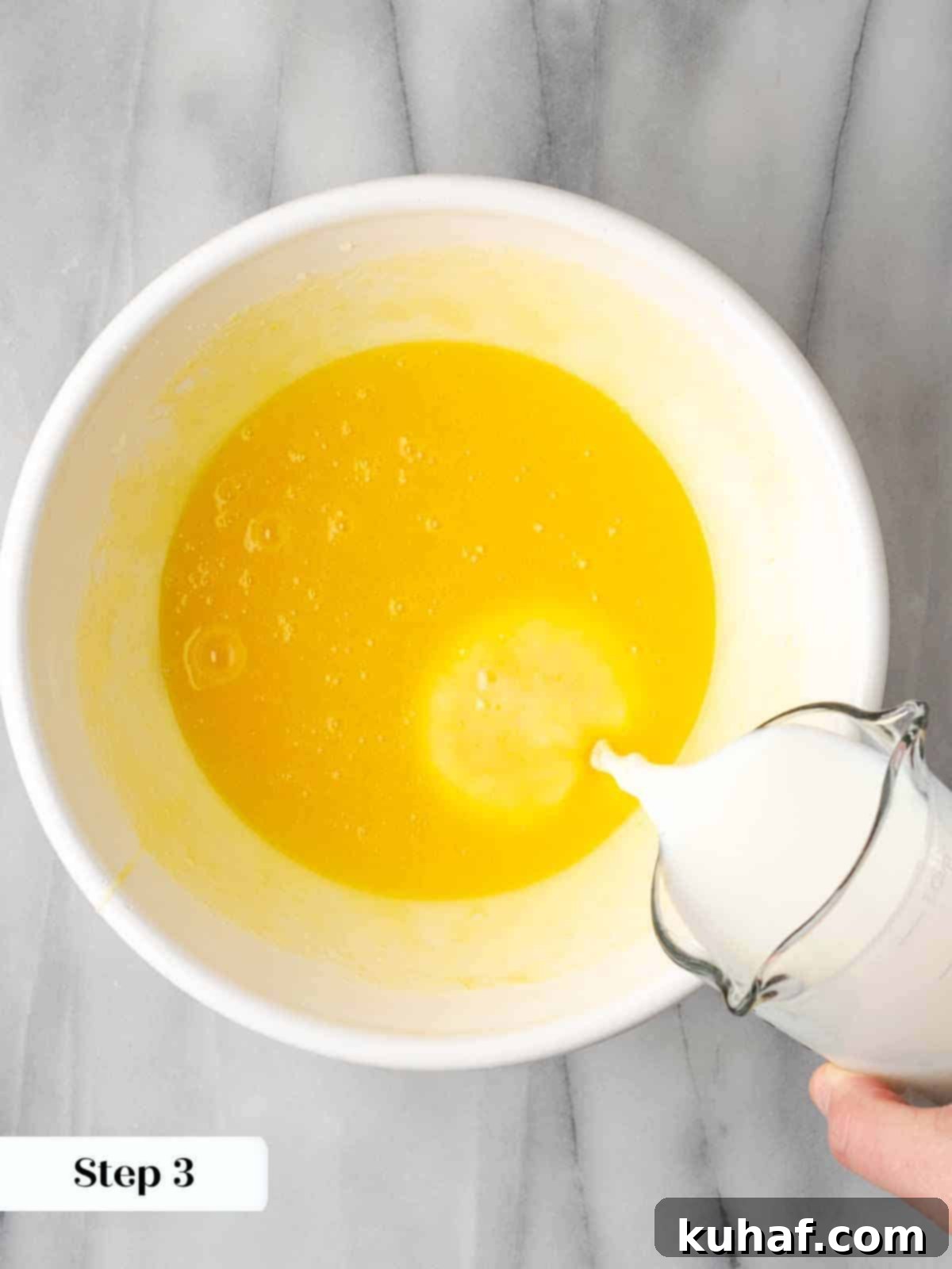 adding buttermilk mixture to cornbread batter.
