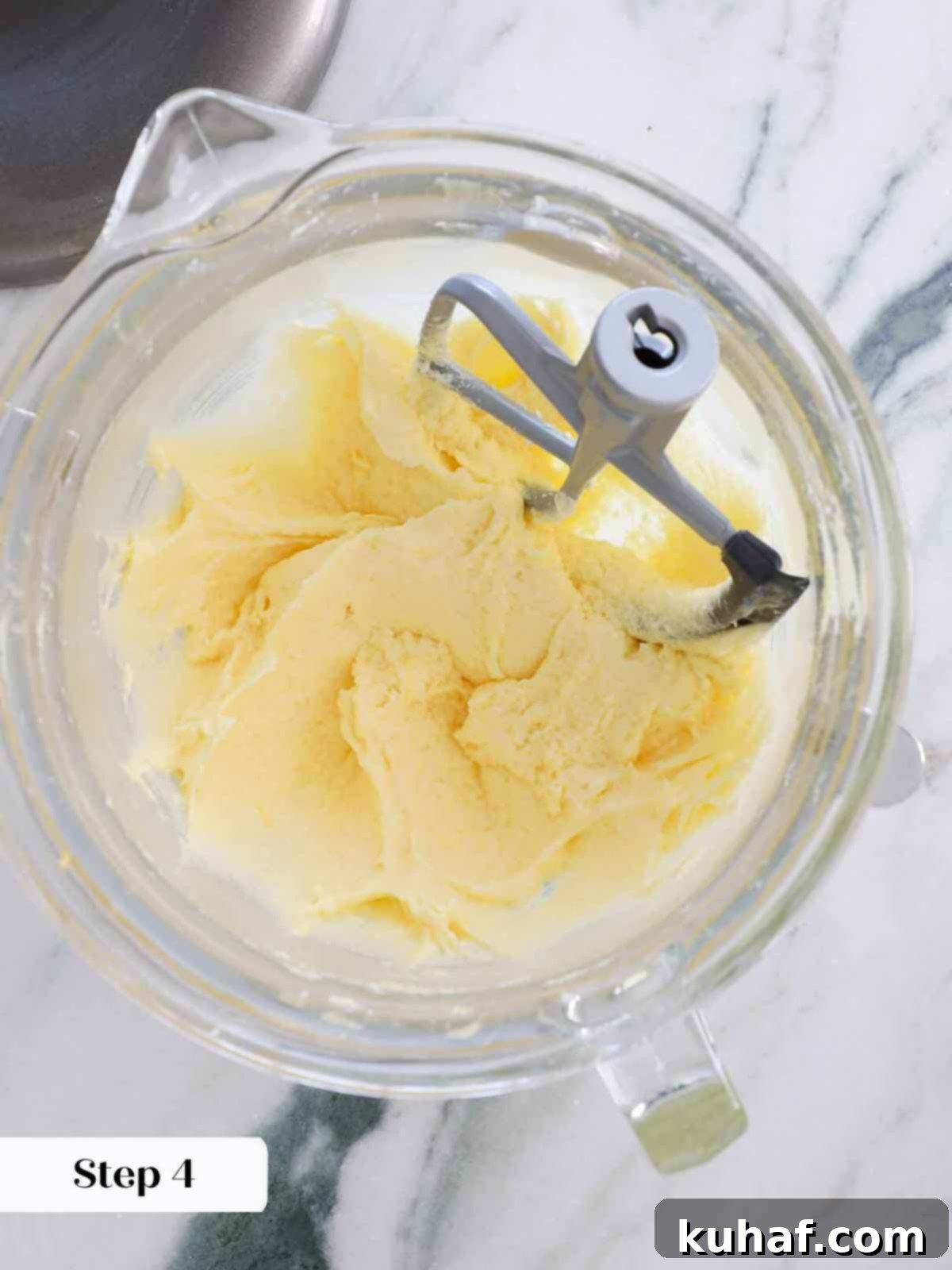 Emulsified eggs, butter, and sugar mixture, smooth and pale yellow.