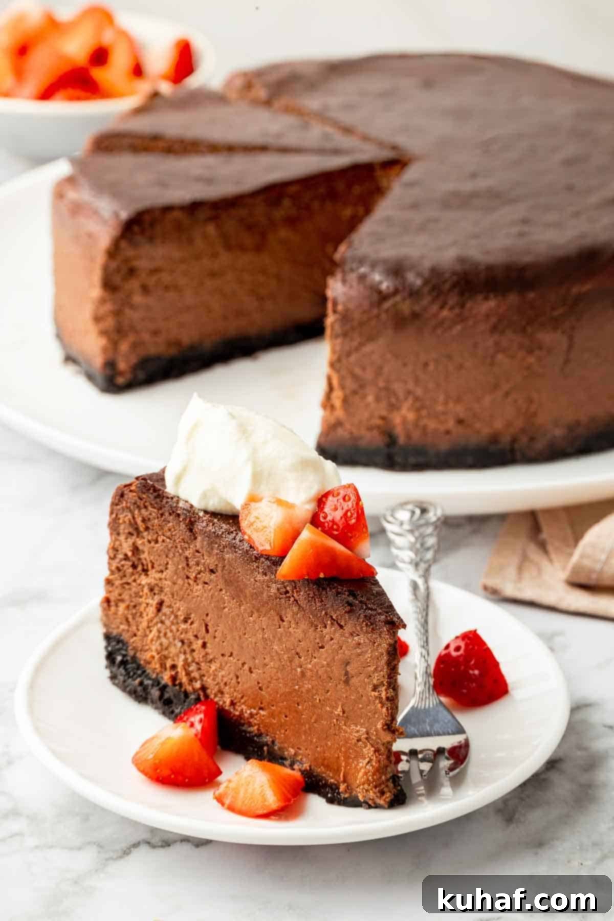 chocolate cheesecake with oreo crust sliced.