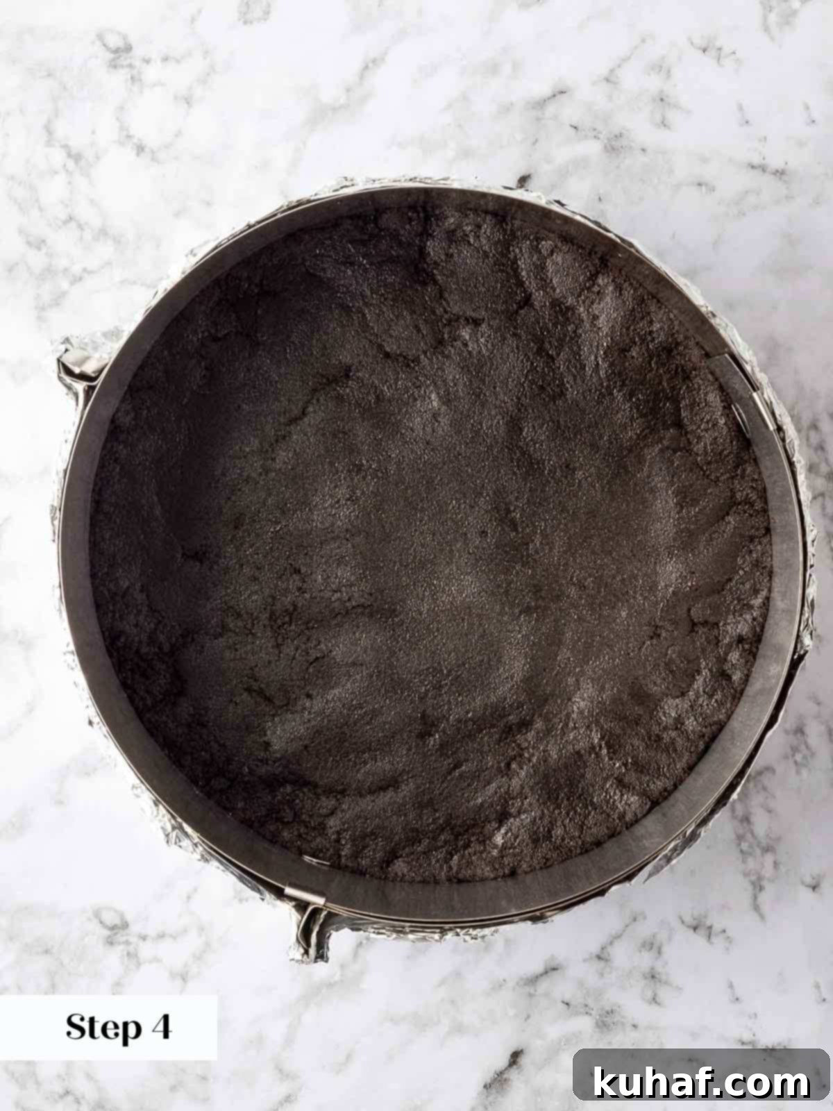 pressed oreo crust into lined springform pan.