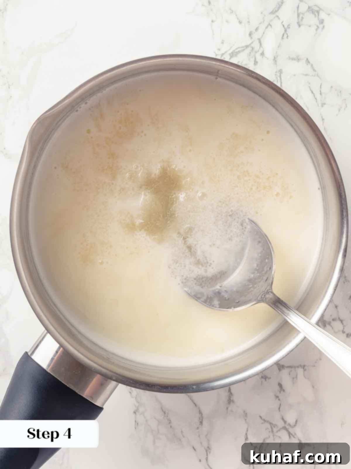 melting bloomed gelatin in hot cream.