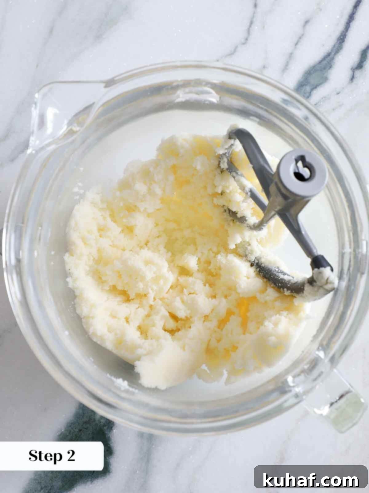 Butter and sugar being creamed together in a mixing bowl as the base for the cookie dough.