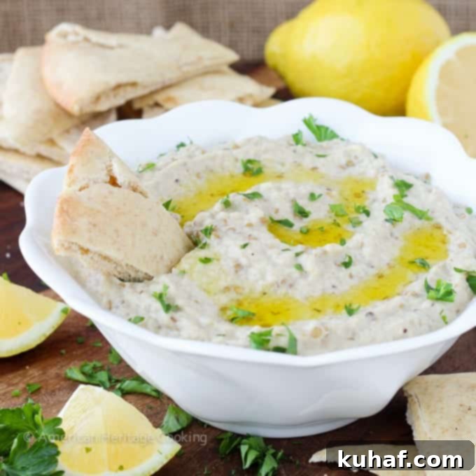 Baba Ganoush 2 A beautifully presented bowl of Baba Ganoush, garnished with fresh parsley and a drizzle of olive oil, ready to be served with pita bread.